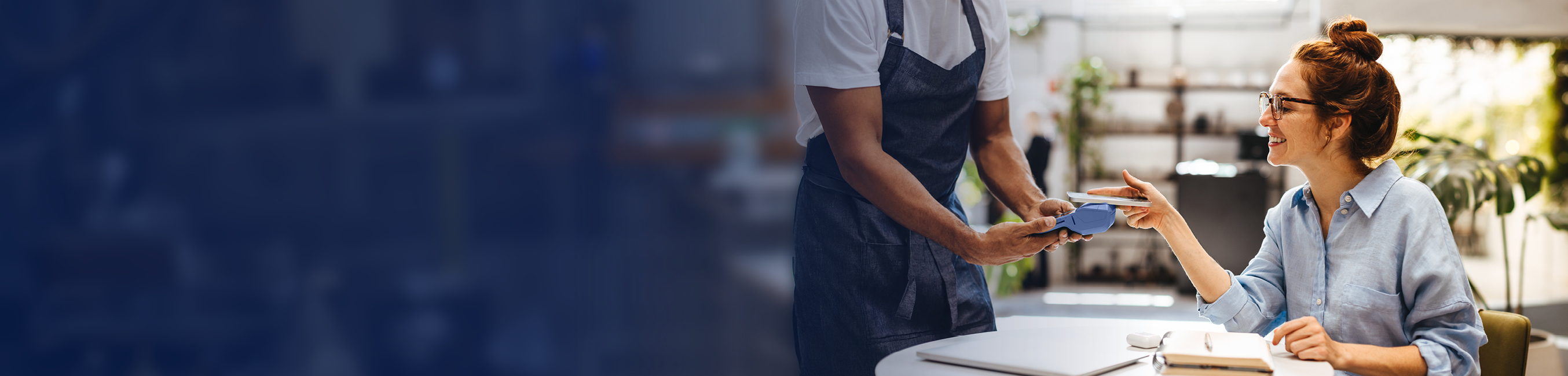 Woman using tap to pay at a restaurant 