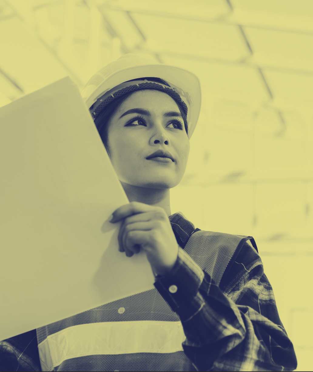 Woman construction worker looking at plans