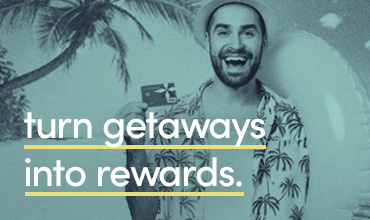 turn getaways into rewards. Man holding credit card.
