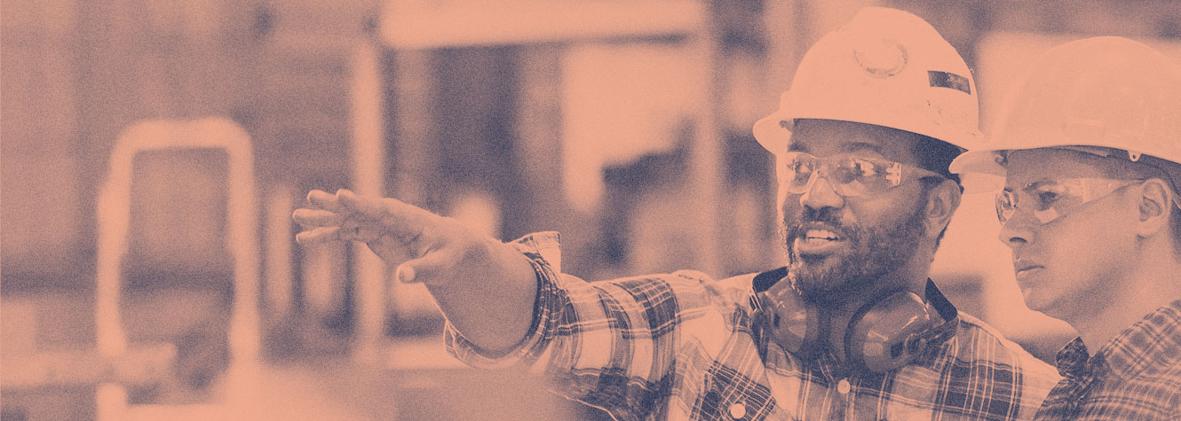 Diverse warehouse workers with hard hats