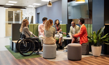 Team of associates gathered in conversation.