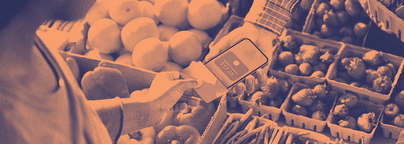 Merchant using iPhone to take payment via debit card